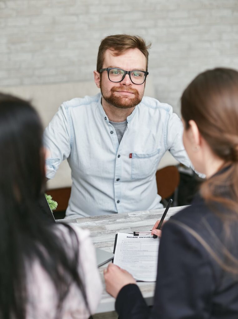 a couple talking to a mortgage lender