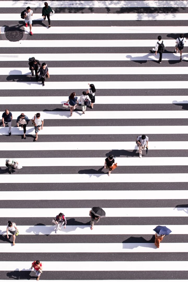 People walking across a zebra crossing