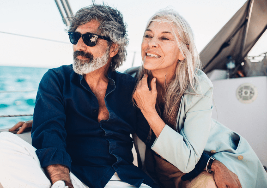 older couple enjoying a boat ride