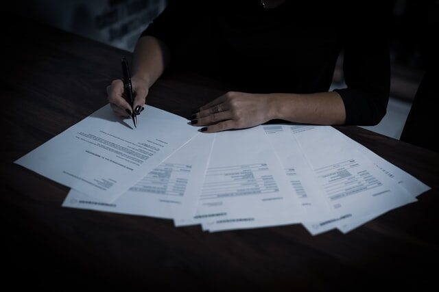 A private lender analyzing financial paperwork